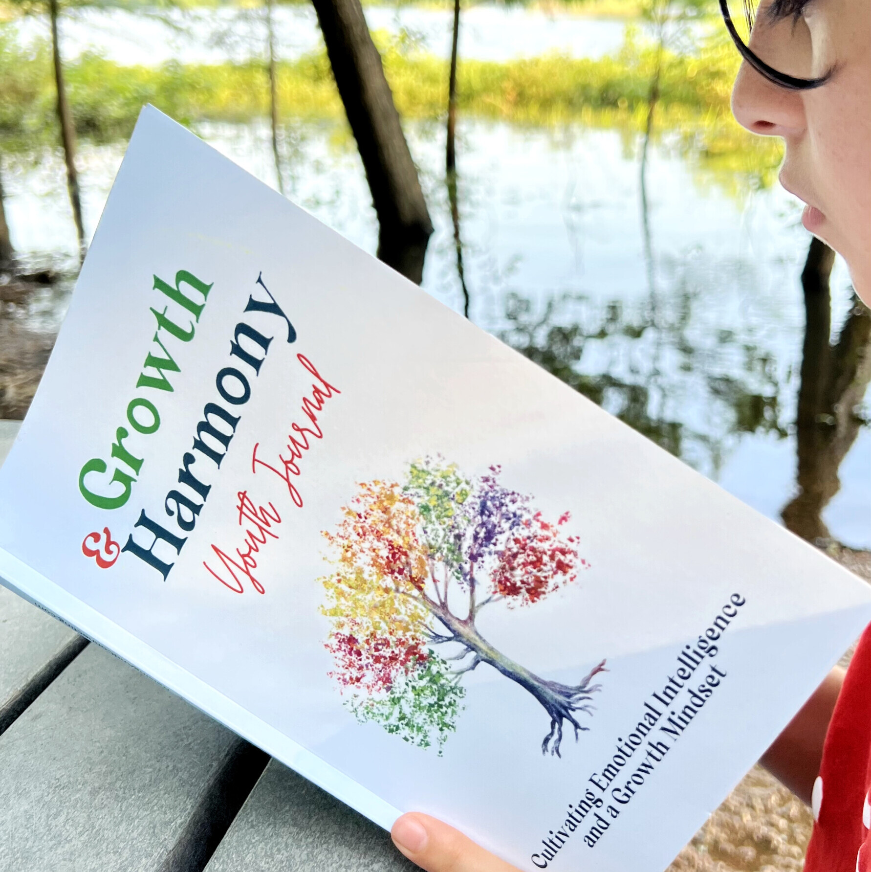 girl reading her growth and harmony youth journal